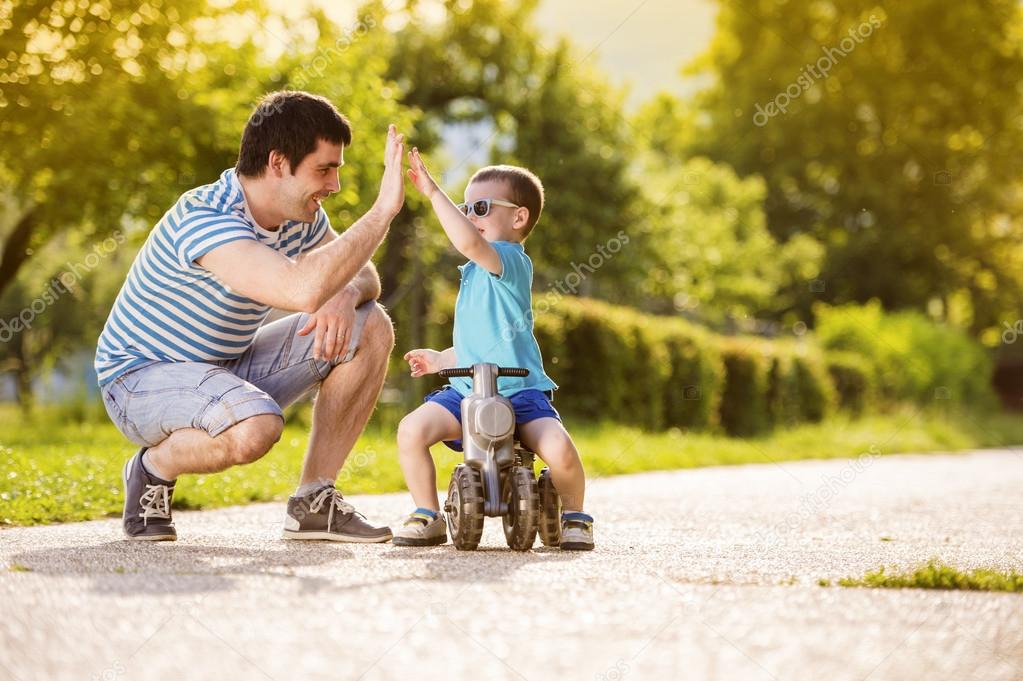 Father with son on motorbike