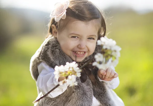 Girl with blooming branch — Stock Photo, Image
