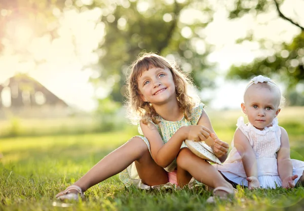 Cute sisters in park — Stock Photo, Image