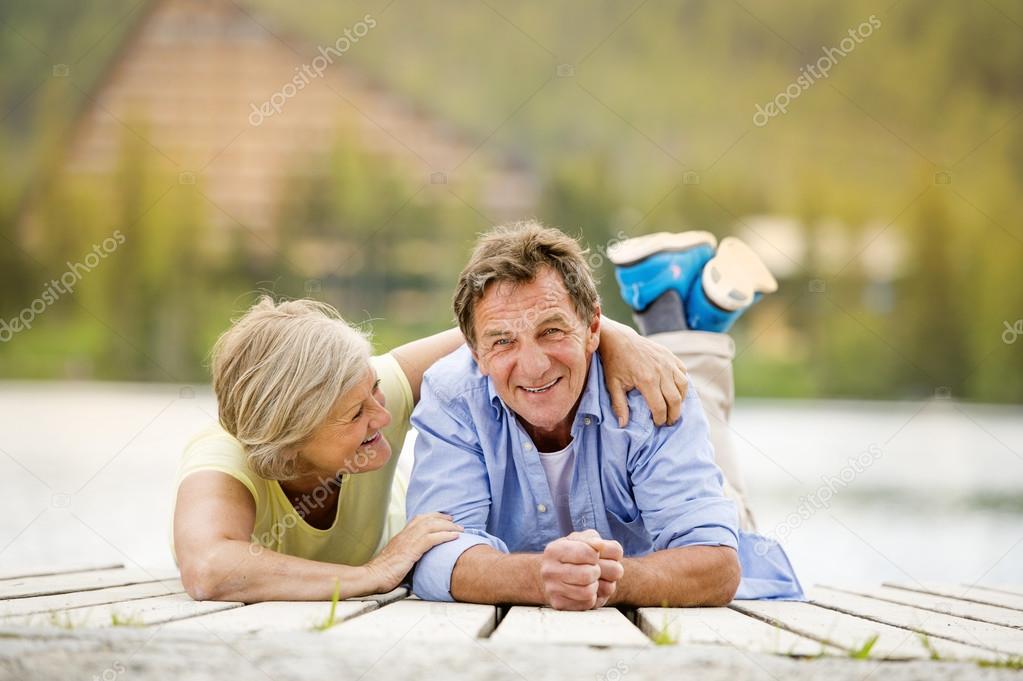 Senior couple having fun on pier
