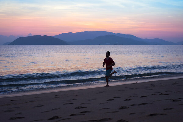 Man running at sunset