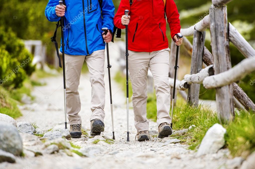 Legs of couple hiking at mountains