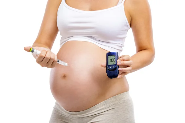 Pregnant woman with syringe in hand — Stock Photo, Image