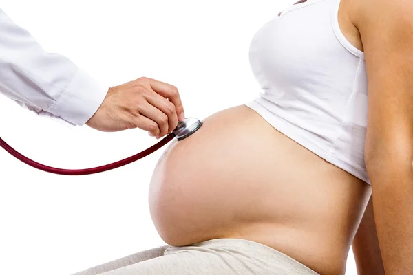 Woman being given prenatal check by doctor — Stock Photo, Image