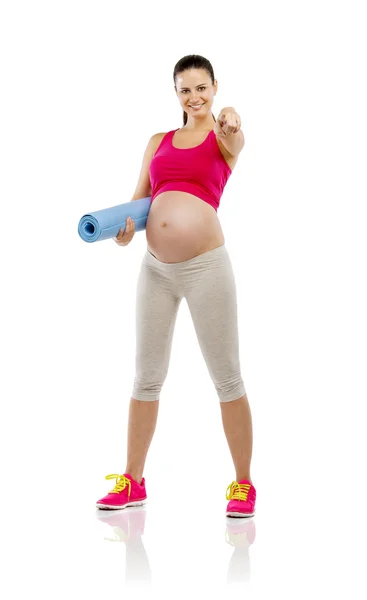 Pregnant woman holding mat — Stock Photo, Image