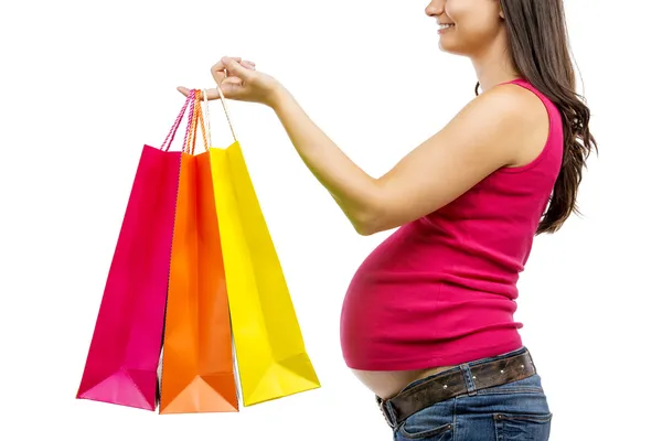 Pregnant woman with shopping bags — Stock Photo, Image