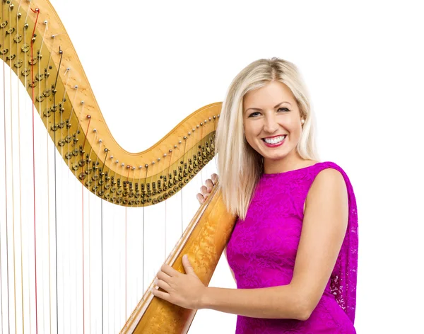 Mulher elegante tocando harpa — Fotografia de Stock