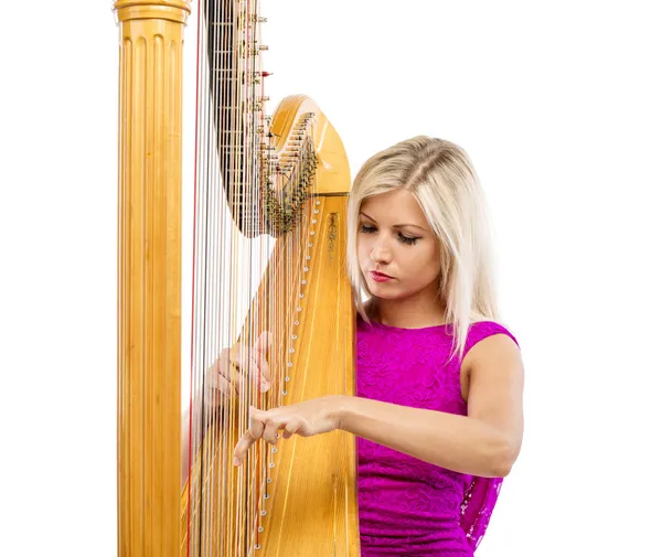 Femme élégante jouant de la harpe — Photo