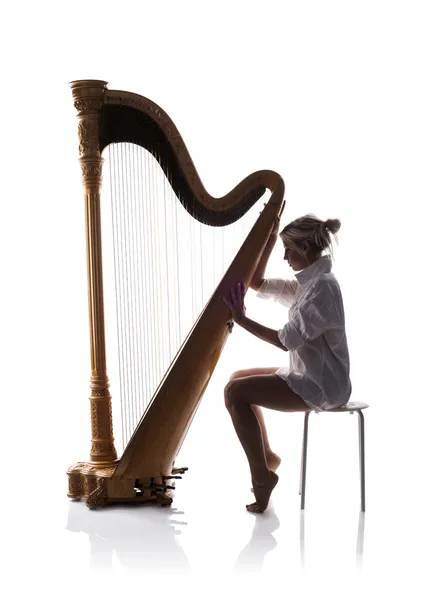 Mulher tocando harpa — Fotografia de Stock