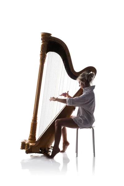 Femme jouant de la harpe — Photo