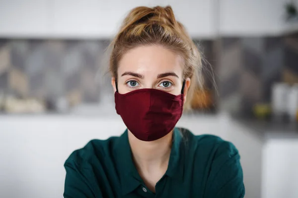 Portrait of young woman with face mask indoors at home. — Stock Photo, Image