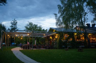 Modern restaurant with terrace in evening illumination