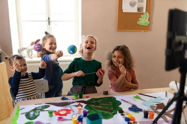 Little kids working on project during creative art and craft class at school. — стоковое фото