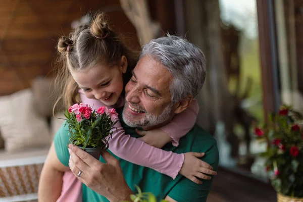 Portrait of little cute daughter hugging her happy father at home. — Zdjęcie stockowe