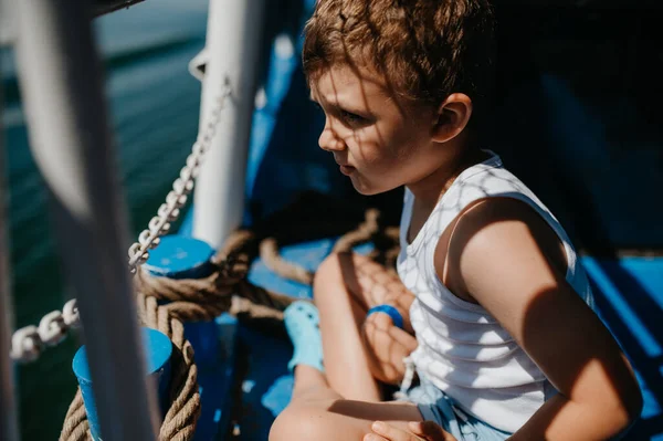 Little Curious Boy Looking Water Motor Boat — Stock fotografie
