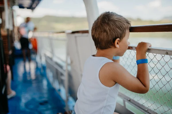 Little Curious Boy Looking Water Motor Boat — Stockfoto