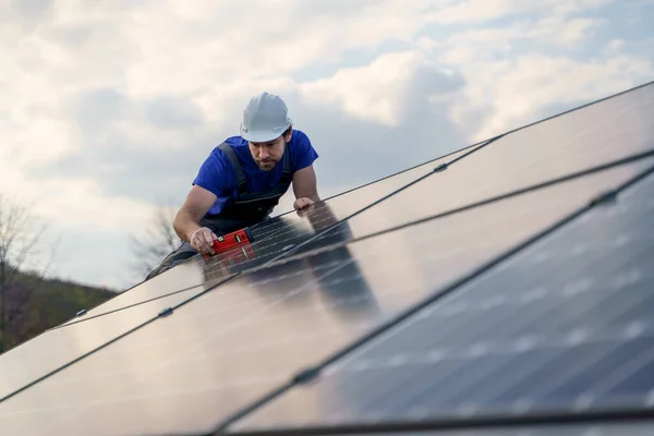 Man Worker Installing Solar Photovoltaic Panels Roof Alternative Energy Concept — 图库照片