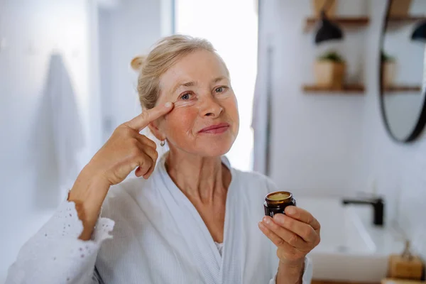 Beautiful Senior Woman Bathrobe Applying Natural Face Cream Bathroom Skin — Foto Stock