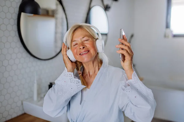Beautiful Senior Woman Bathrobe Drinking Tea Bathroom Relax Wellness Concept — Stok Foto