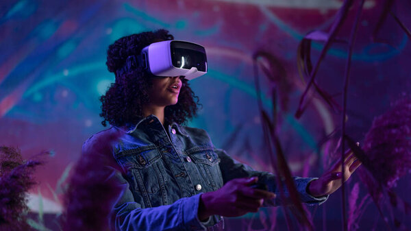 Metaverse digital cyber world technology, girl with virtual reality VR goggles playing augmented reality game, futuristic lifestyle