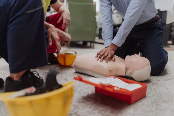 Male Instructor Showing First Medical Aid Doll Training Course Indoors —  Fotos de Stock