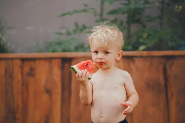 Cute Little Boy Eating Watermelon Garden Summer — Stok fotoğraf