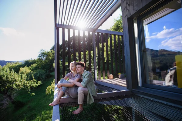 Young Couple Sitting Cuddling Hammock Terrace New Home Tiny House — ストック写真