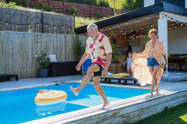 Happy Senior Couple Having Fun Walking Swimming Pool Summer Generation — Stock Fotó