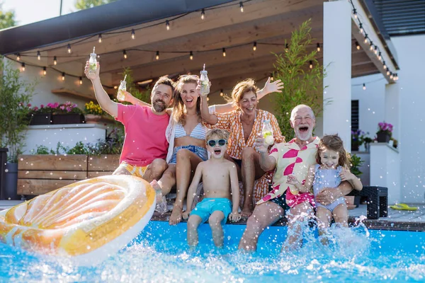 Multi Generation Family Enjoying Drinks Splashing Sitting Backyard Pool — Stock Fotó