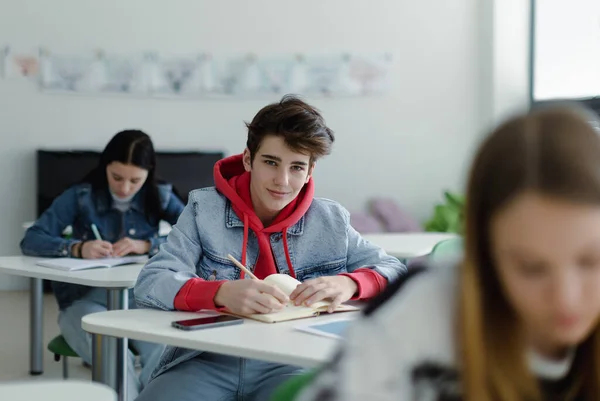 High School Students Paying Attention Class Sitting Desks Writing Notes — 스톡 사진