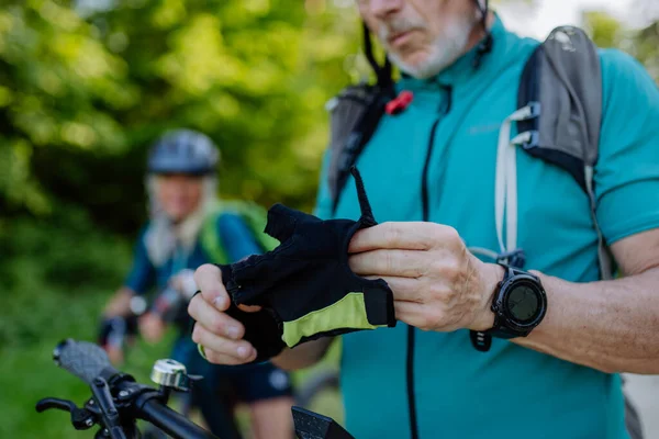 Close Senior Man Biker Putting Bicycle Gloves — Stockfoto