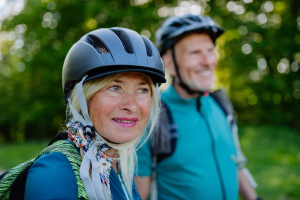 Active Senior Couple Riding Bicycles Summer Park Woman Bicycle Helmet — ストック写真