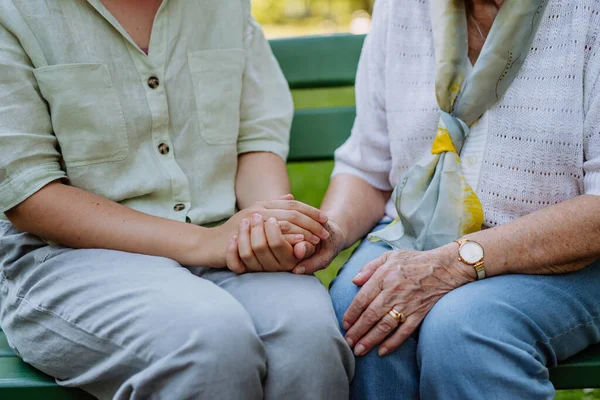 Close Granddaughter Consoling Her Senior Grandmother Touching Her Hand Sitting — Fotografia de Stock