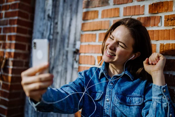 Happy Young Woman Denim Jacket Leaning Brick Wall Outdoors Summer — Φωτογραφία Αρχείου