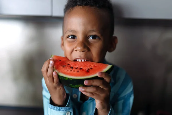 Multiracial Boy Eating Melon Kitchen Hot Sunny Days — ストック写真