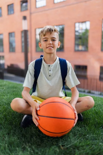 Cheerful Caucasian Boy Sitting Public City Park Baskaetball Ball Looking — 스톡 사진