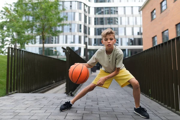 Cheerful Caucasian Boy Driblling Basketball Ball Public City Park Looking — 스톡 사진