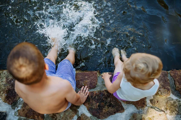 Cute Girl Boy Sitting Together Footpath Lake Dangle Feet Water — Stock fotografie