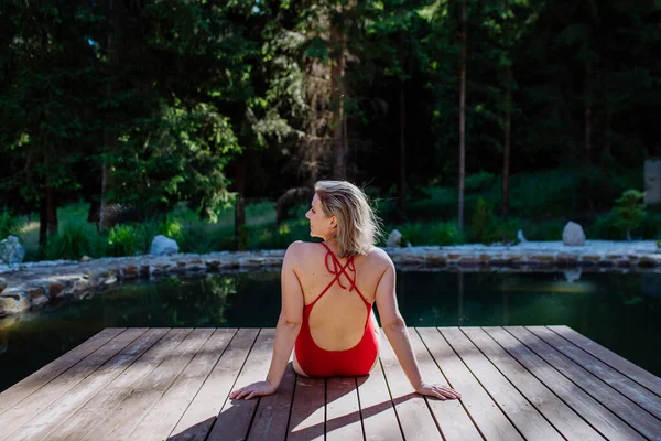 Rear View Young Woman Swimsuit Sitting Pier Lake Summer Vacation — Stockfoto