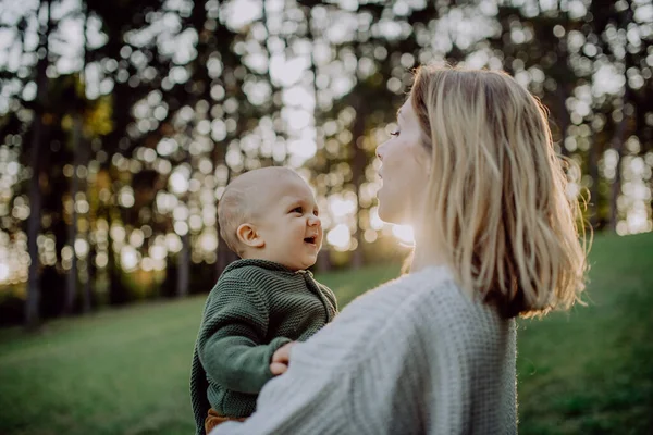 Mother Holding Her Little Baby Son Wearing Knitted Sweater Walk — Foto Stock