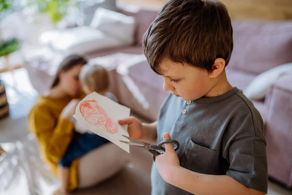 Little Boy Cutting Drawn Picture Having Creative Time Home — стоковое фото