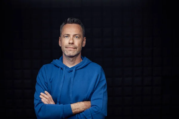 Portrait Happy Mature Man Arms Crossed Standing Studio Dark Background — Fotografia de Stock