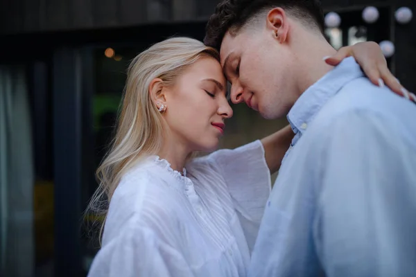 Young Couple Love Cuddling Kissing Outdoors Terrace Weekend Away Tiny — Stockfoto