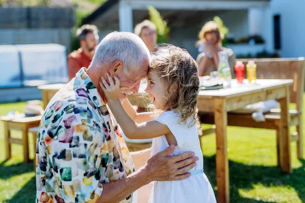 Happy Little Girl Embracing Her Grandfather Generation Family Birthday Party — 스톡 사진