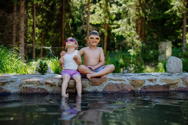 Cute Girl Boy Sitting Together Footpath Lake Sun Glasses Dangle — стоковое фото