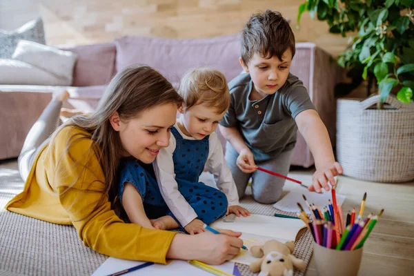 Happy Mother Her Little Children Home Drawing Together — Stock Fotó