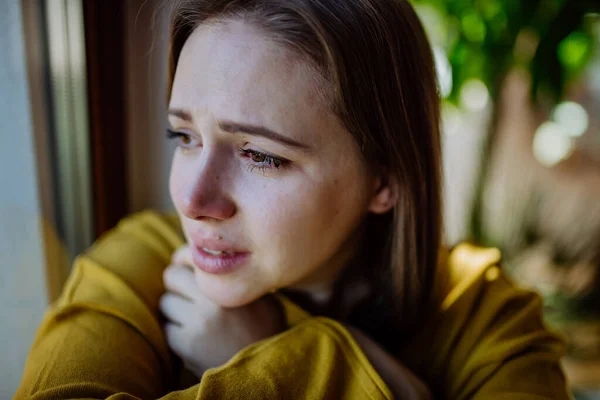 Young Woman Suffering Depression Home Crying Looking Trough Window — 图库照片