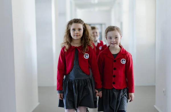 Happy Schoolgrirl Syndrome Uniform Walking School Corridor Her Friend Holding — 스톡 사진