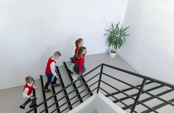 High Angle View Schoolchildren Uniforms Walking School Staircase — Zdjęcie stockowe