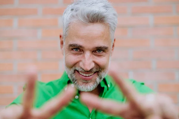 Mature Man Happy Expression Showing Peace Sign Fingers Looking Camera — Stok fotoğraf